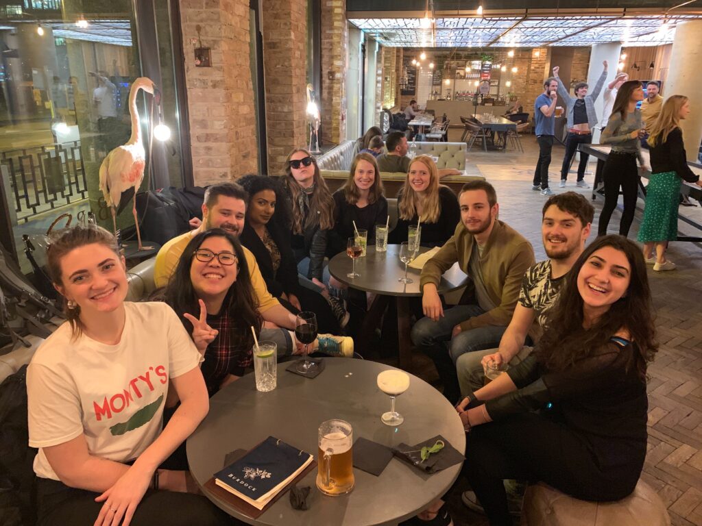A group image of smiley people at a bar in Moorgate. 